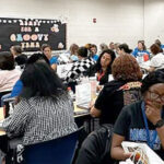 Some of Mooresville’s Student Services staff attend a meeting together.